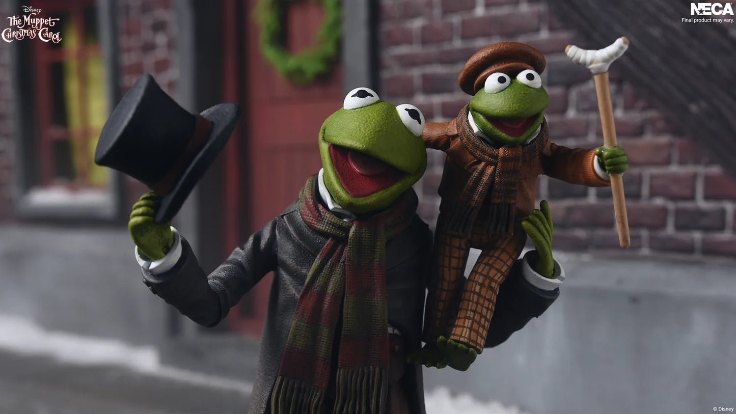 *PRE-ORDER The Muppets Christmas Carol 7 Inch Scale Ultimate Action Figure 2 Pack - Kermit As Bob Cratchit & Robin As Tiny Tim