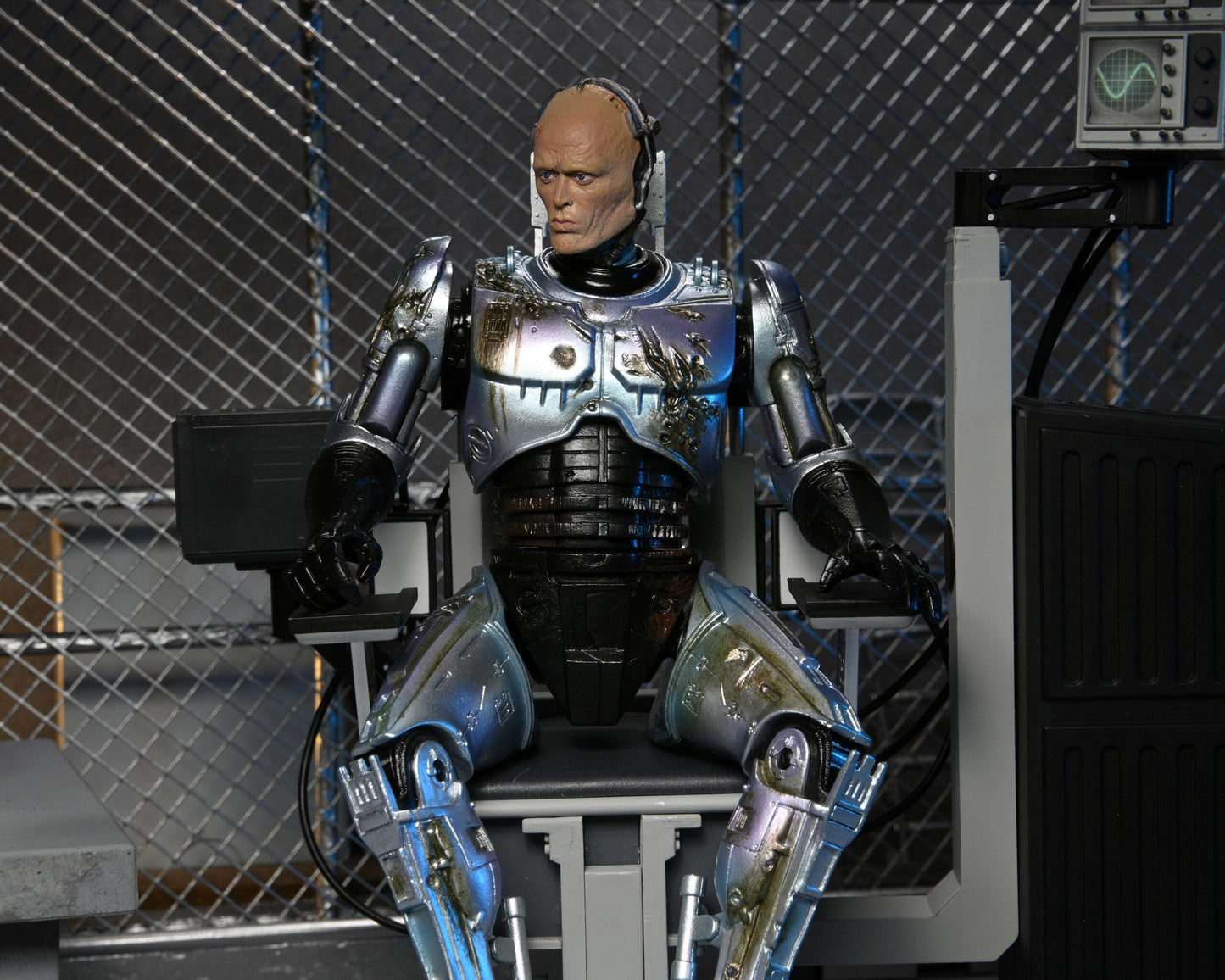 Robocop Battle Damaged Robocop with Chair Ultimate 7 Inch Scale Action Figure
