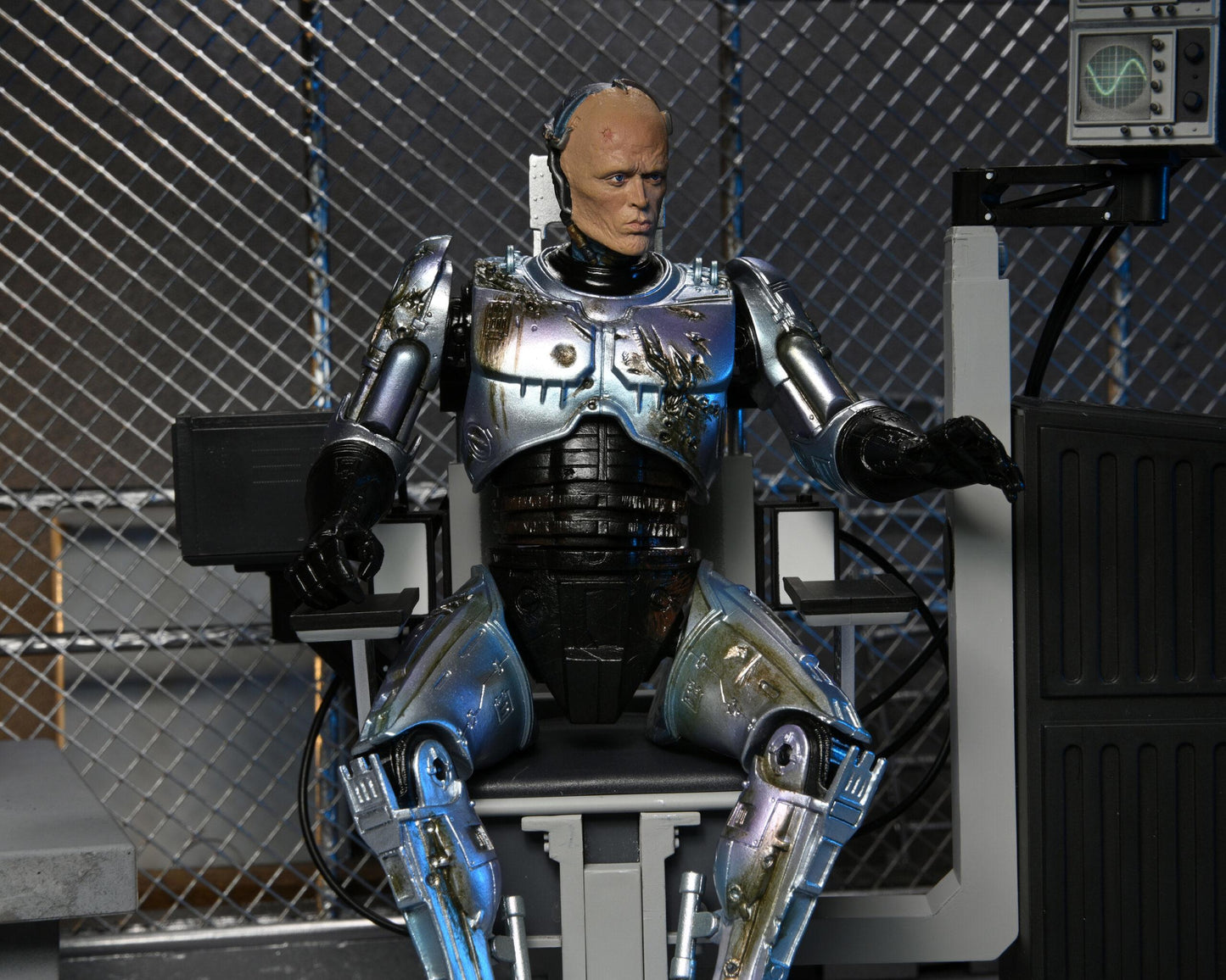 Robocop Battle Damaged Robocop with Chair Ultimate 7 Inch Scale Action Figure